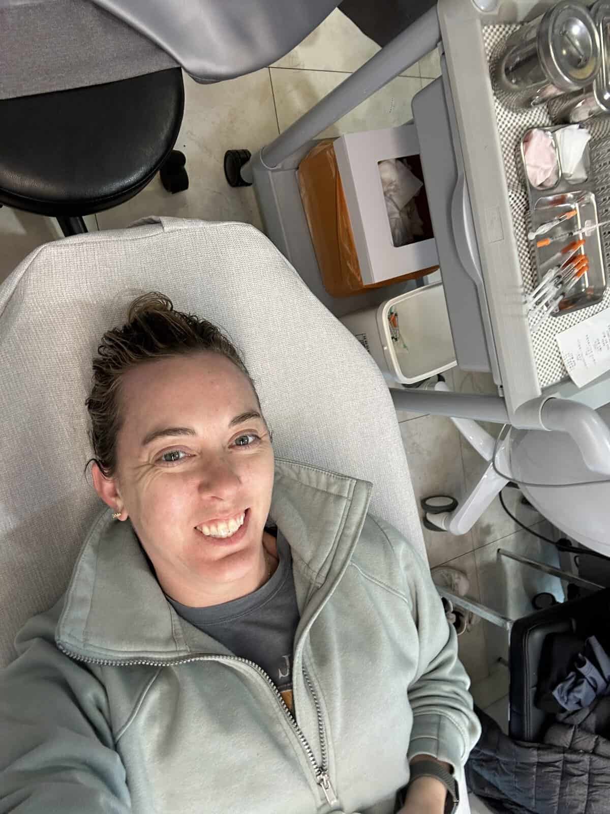 Carli lying down at botox clinic waiting for procedure