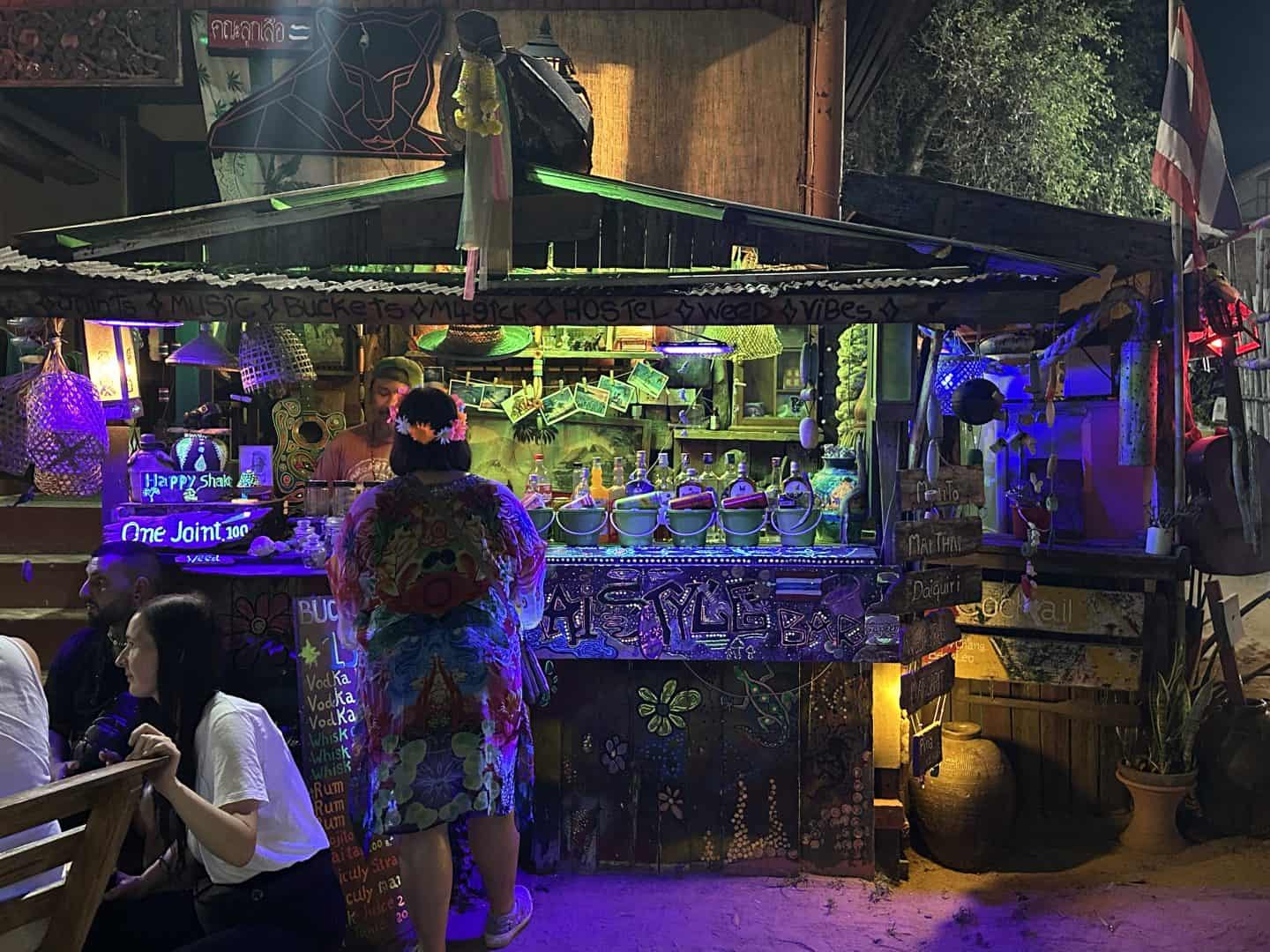 woman in front of Thai Style Bar in Thailand