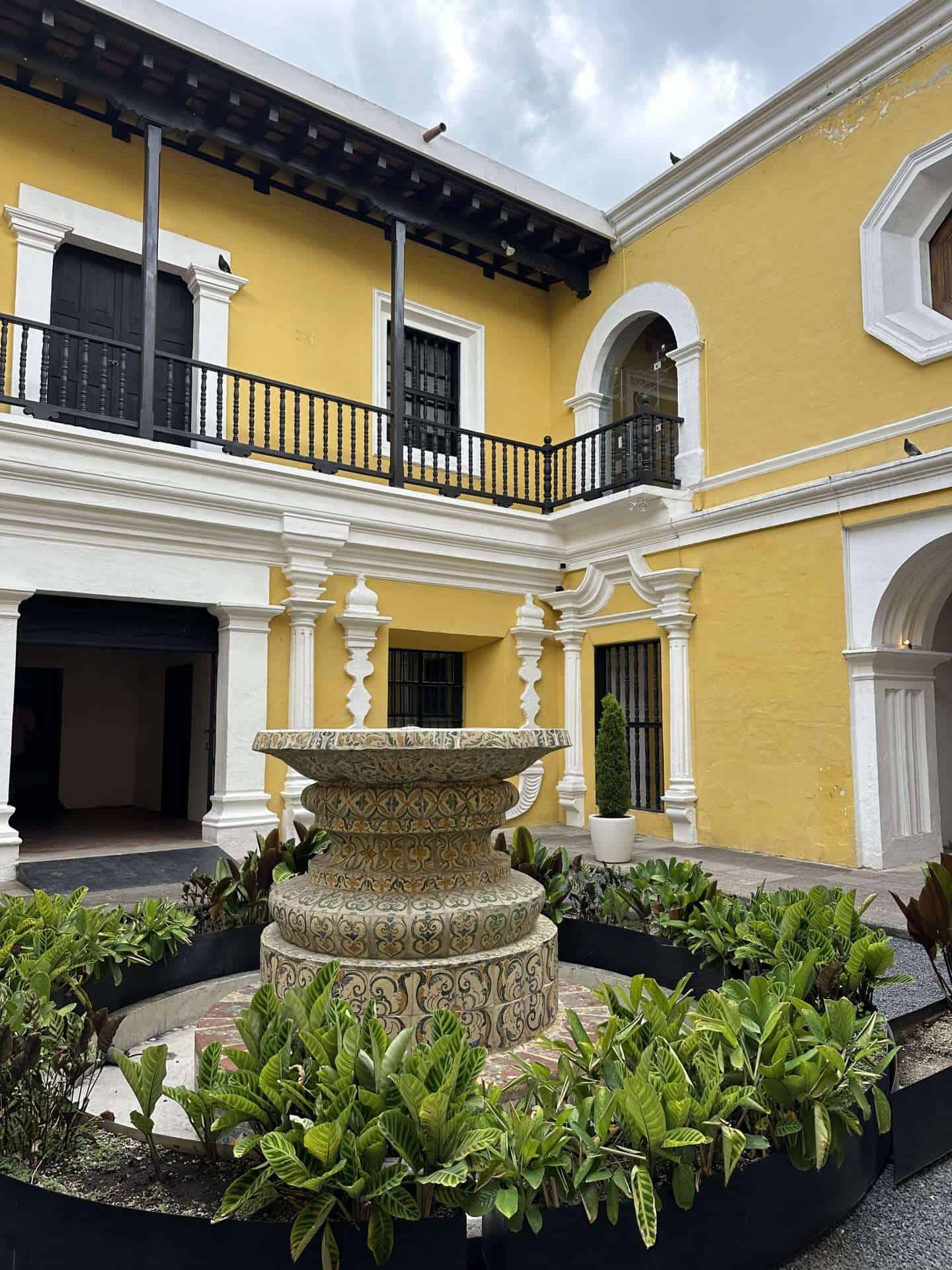 view of yellow courtyard in MUNAG in Antigua Guatemala