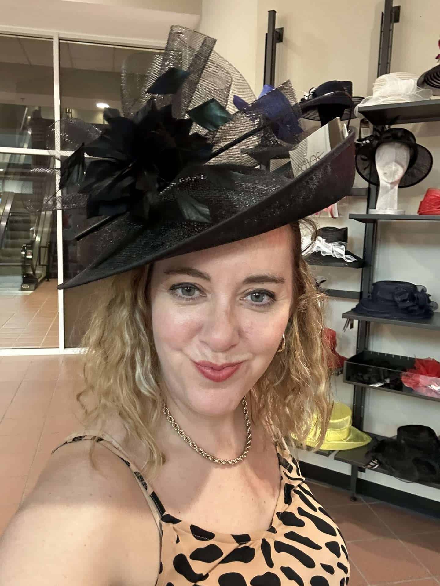 carli with a black fascinator at churchill downs