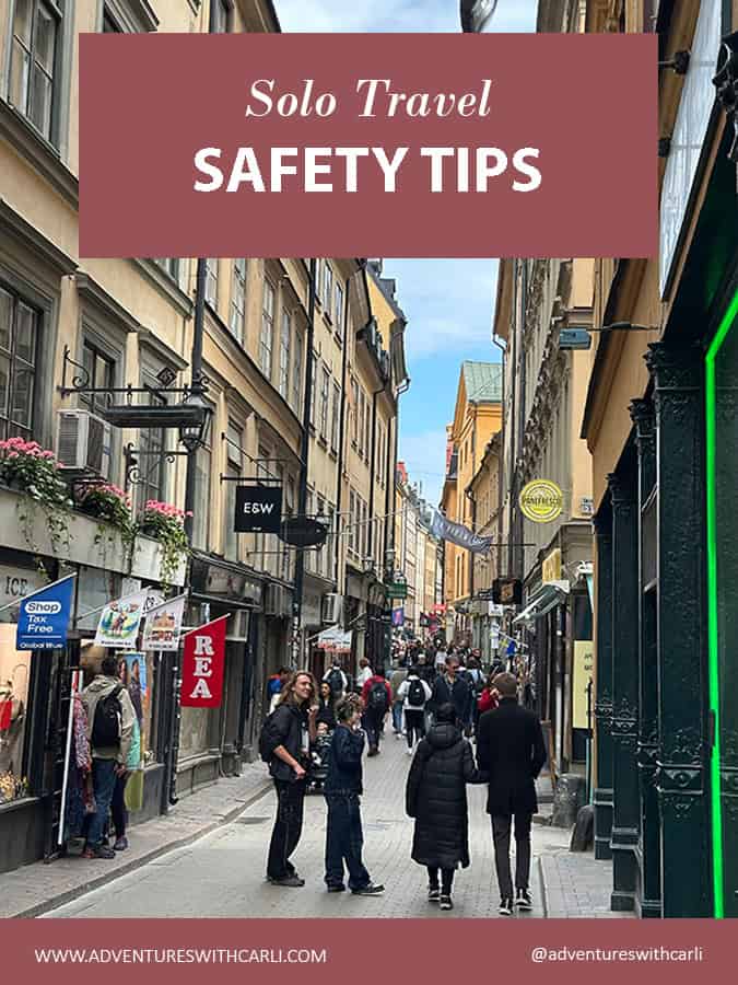 poster reading: solo travel safety tips. street in stockholm old town neighborhood with people walking during the day in background