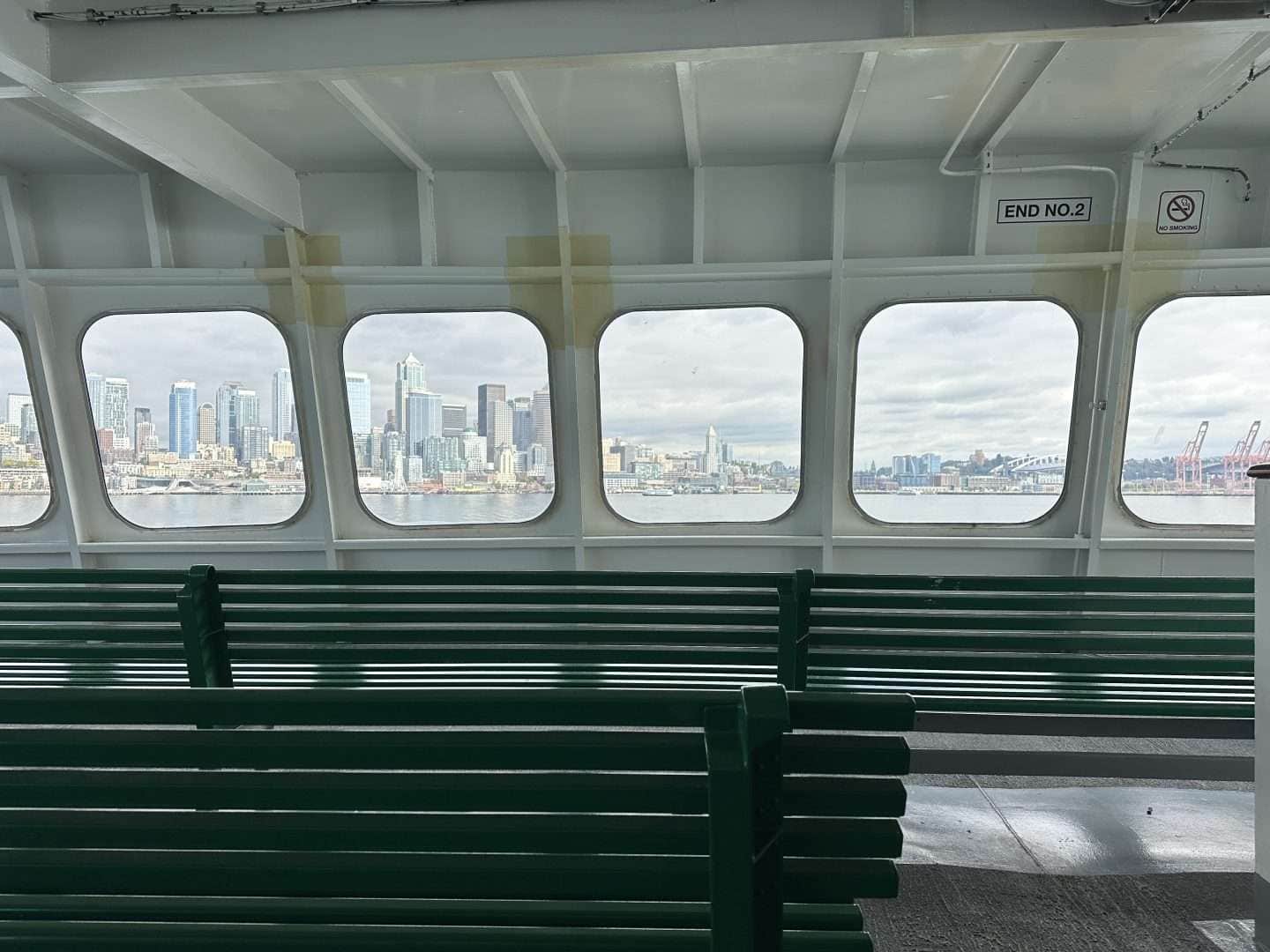 interior of ferry to bainbridge looking out at seattle skyline - day trips from seattle