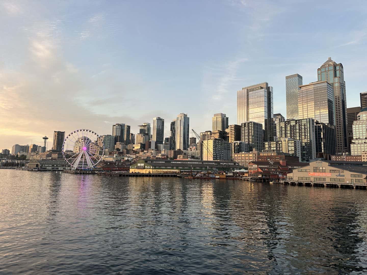 view of seattle skyline at sunset from ferry returning from a day trip to bainbridge island