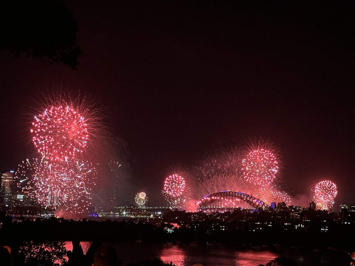 view of NYE fireworks over sydney harbour bridge