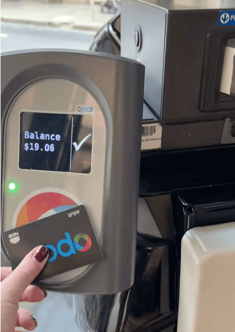 tapping opal transportation card on bus in sydney