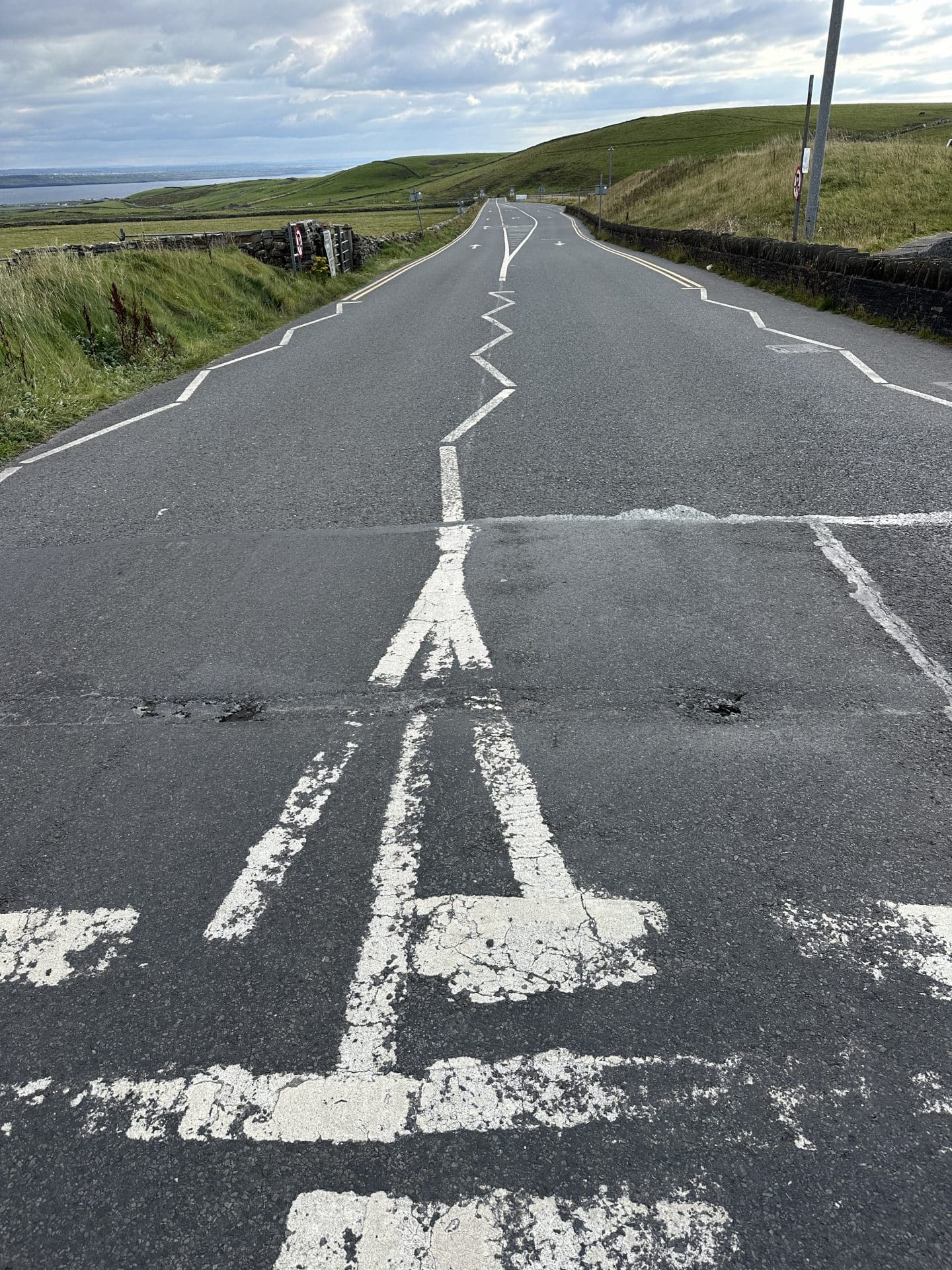 zig zag road and crosswalk outside the cliffs of moher in ireland