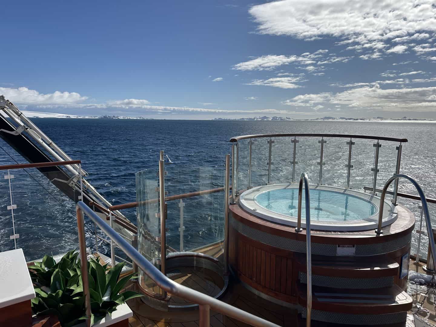 hot tub on the ship with the water in the background