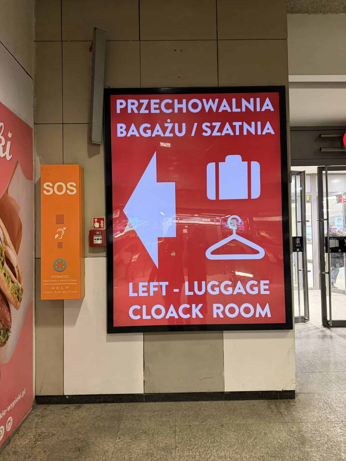 signage pointing to Krakow train station luggage storage