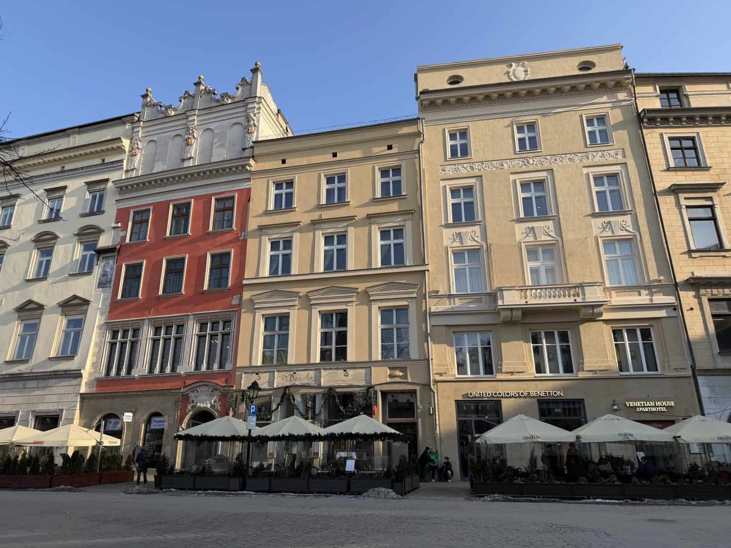 red and beige buildings in krakow poland old town