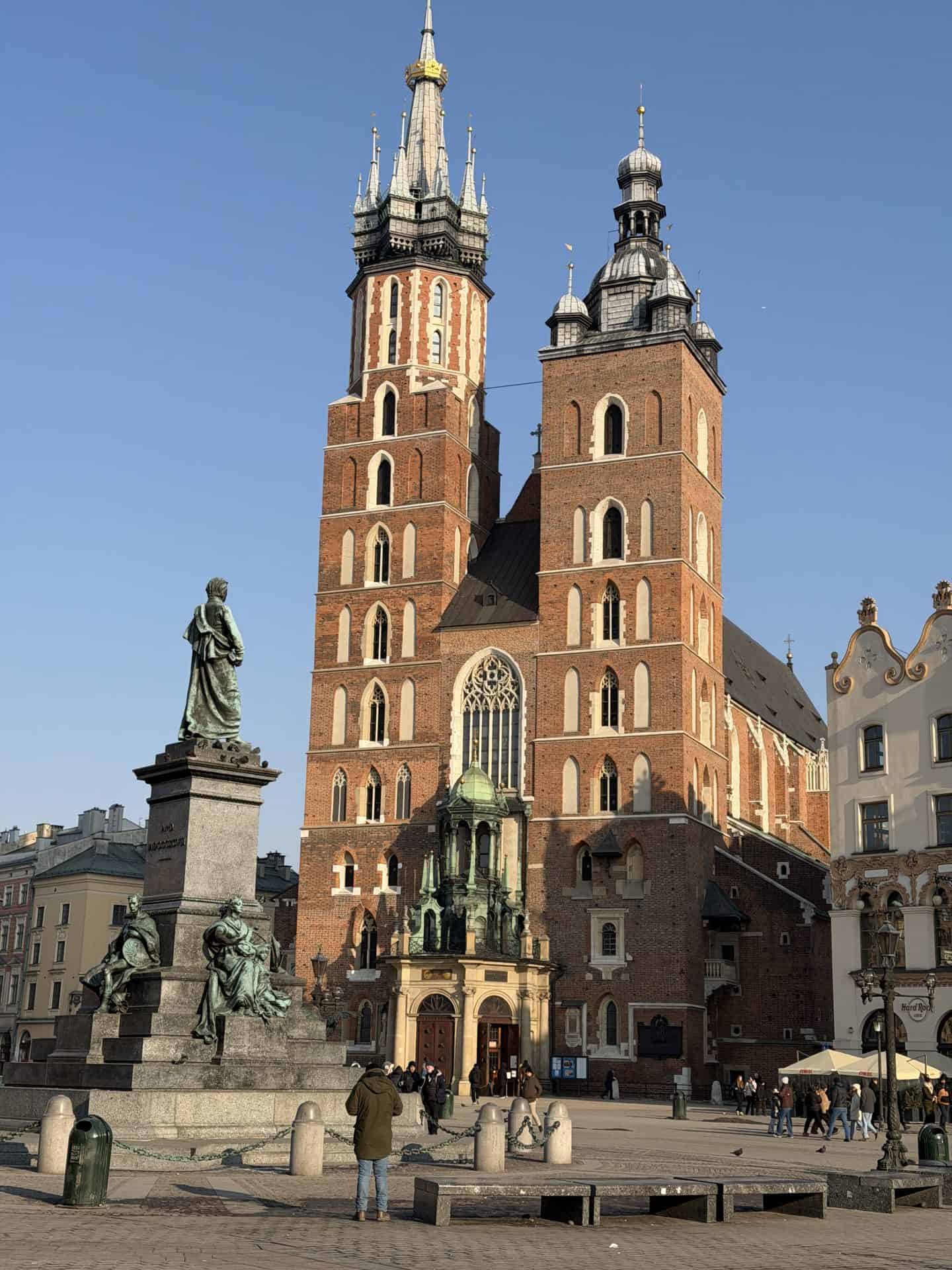 exterior facade of st mary's basilica with dual towers in old town krakow