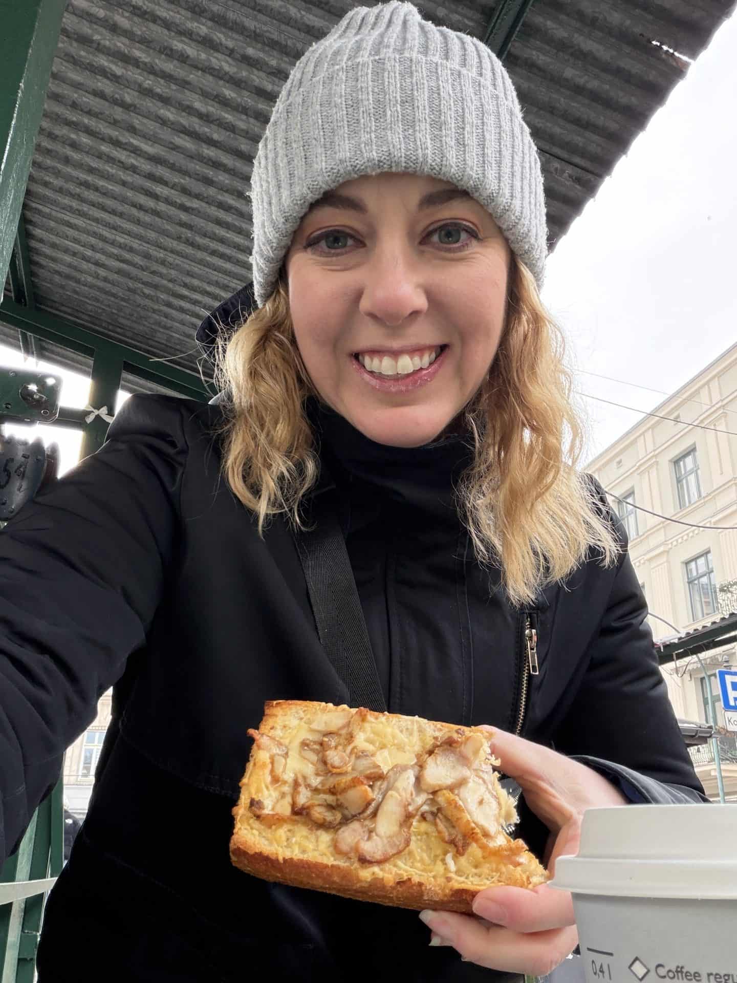 carli holding up a portion of Zapiekanki flatbread in Krakow