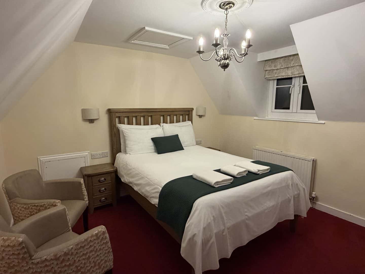 bed in top floor double room at the crown hotel blockley