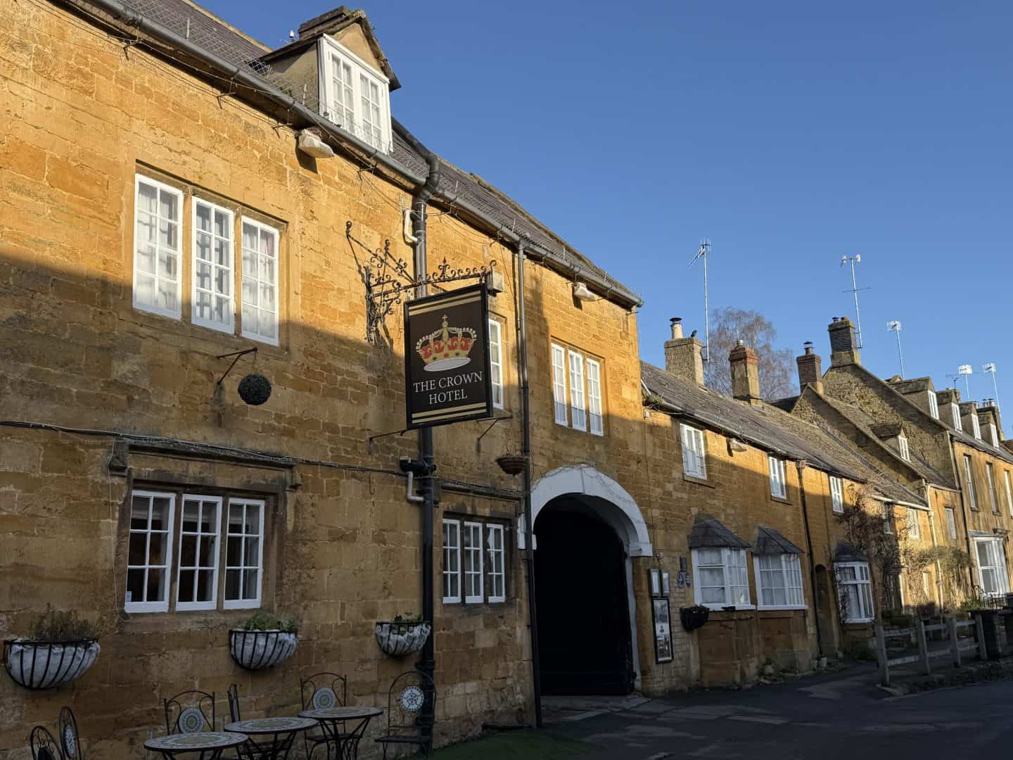exterior of crown hotel blockley with yellow limestone facade