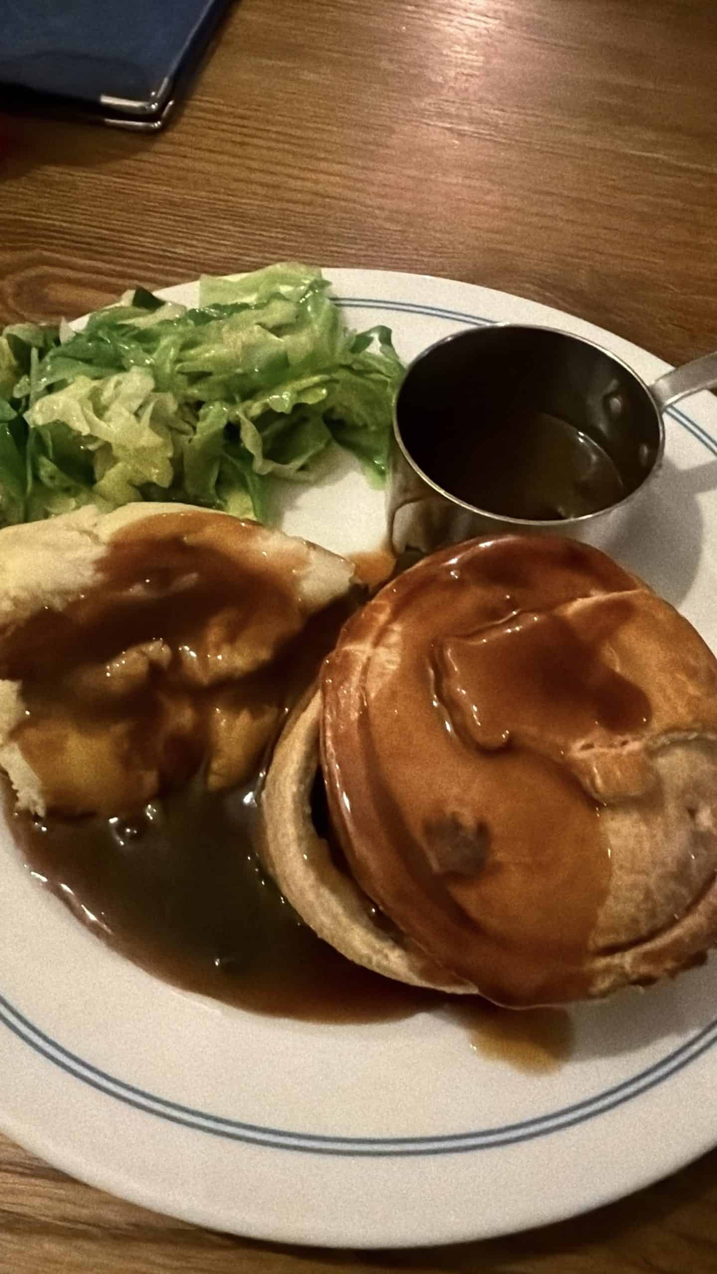 meat pie with mashed potatoes and gravy at a london pub