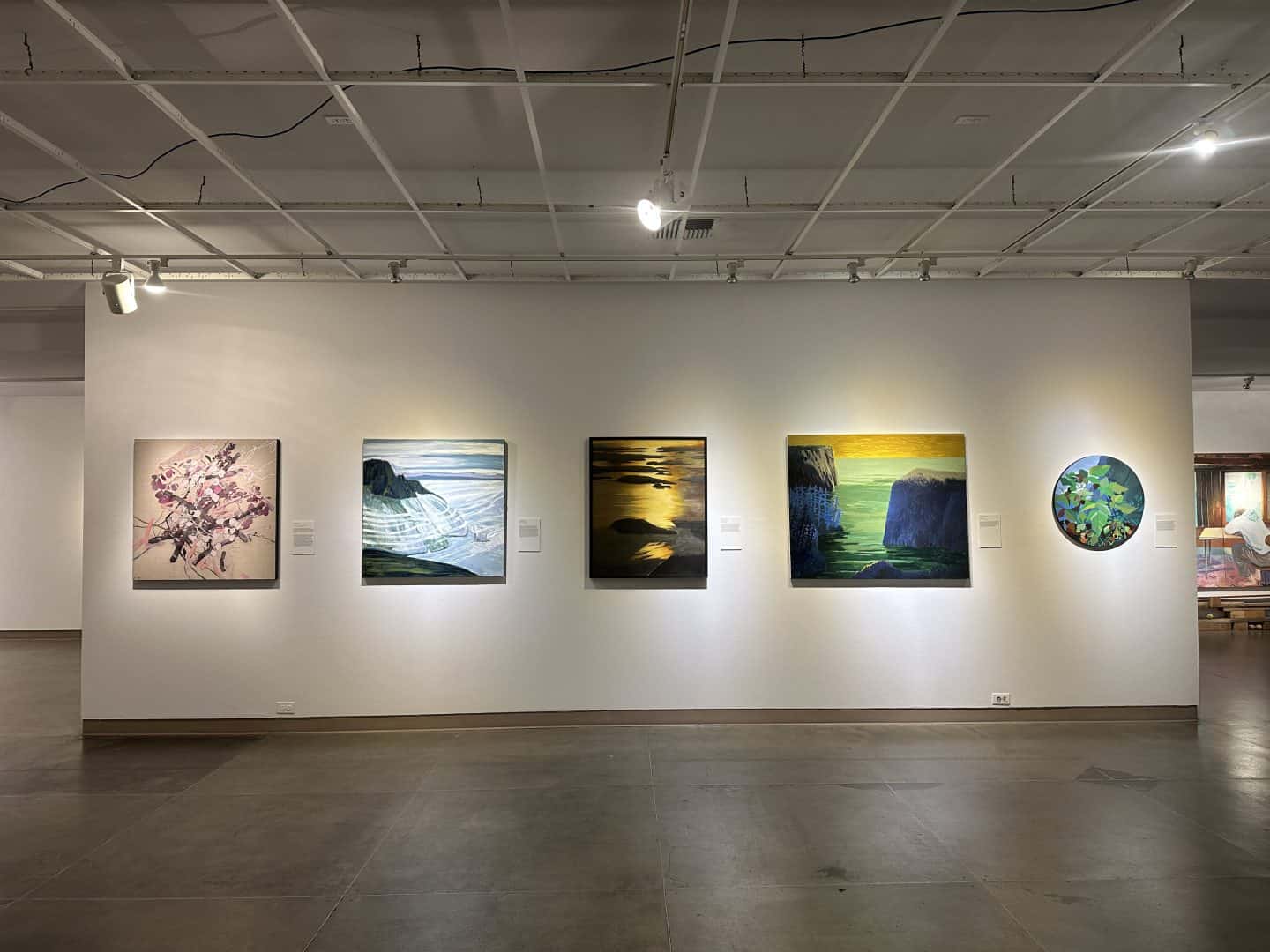 gallery wall with paintings at the museum of northwest art in la conner