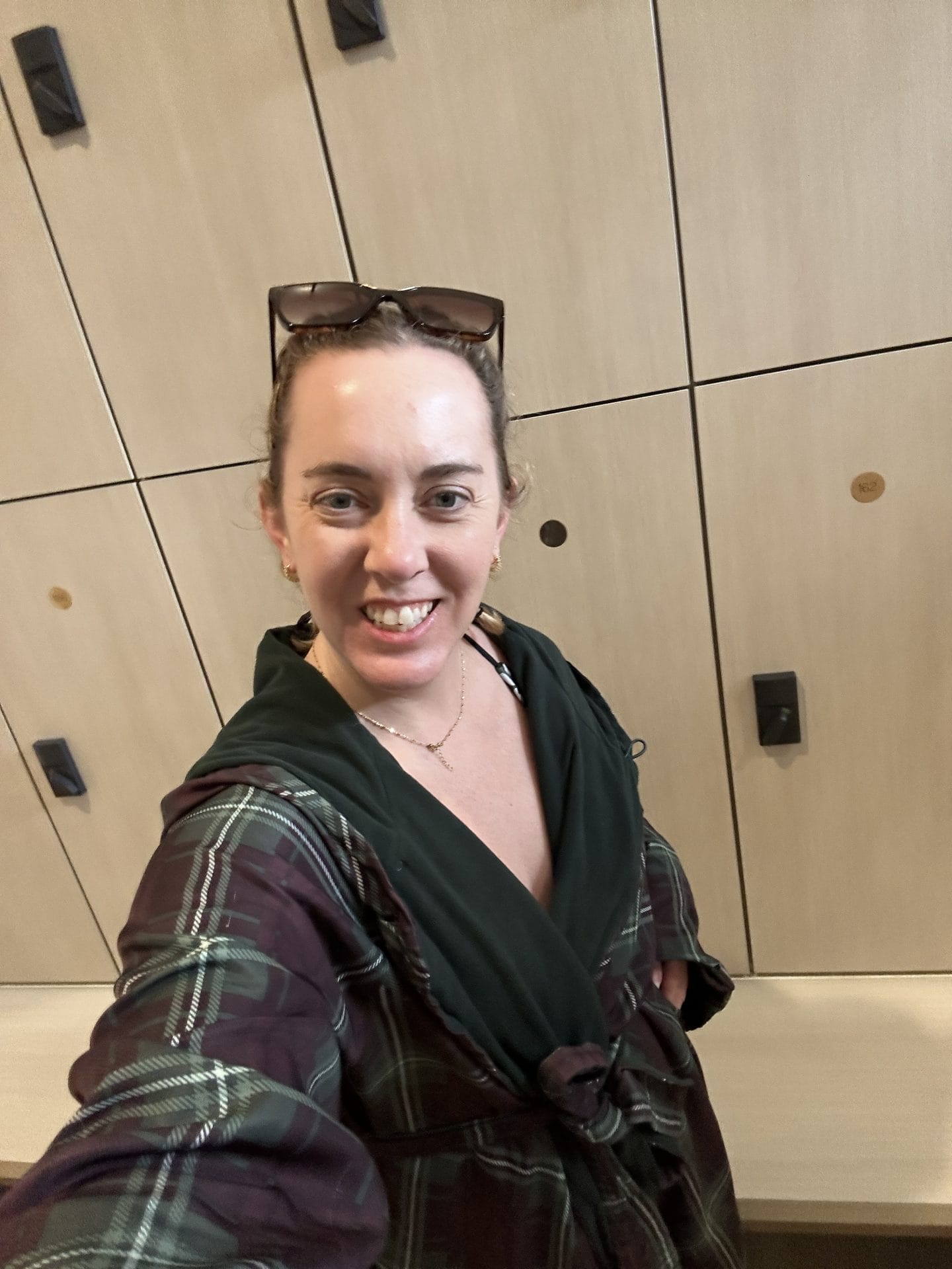 selfie of Carli wearing spa robe in locker