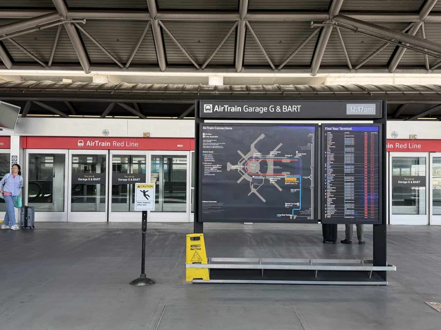 SFO_airtrain_bart_station - Adventures with Carli SFO airtrain station with large airtrain map in center of platform