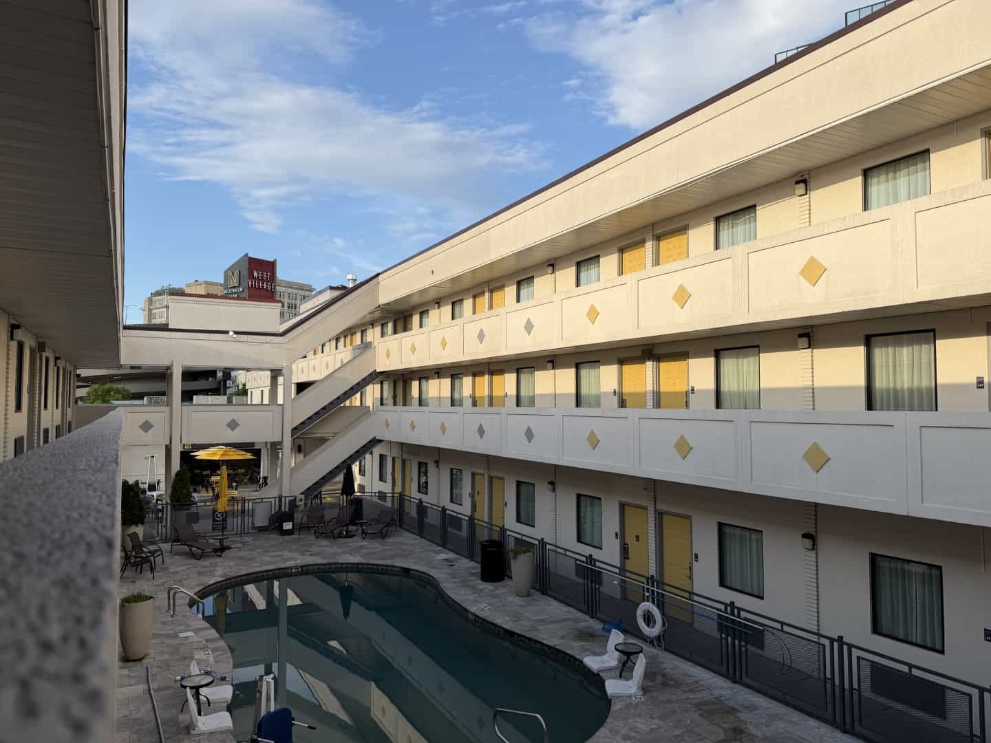 mid century inspired hotel courtyard at golden overlooking pool down below.