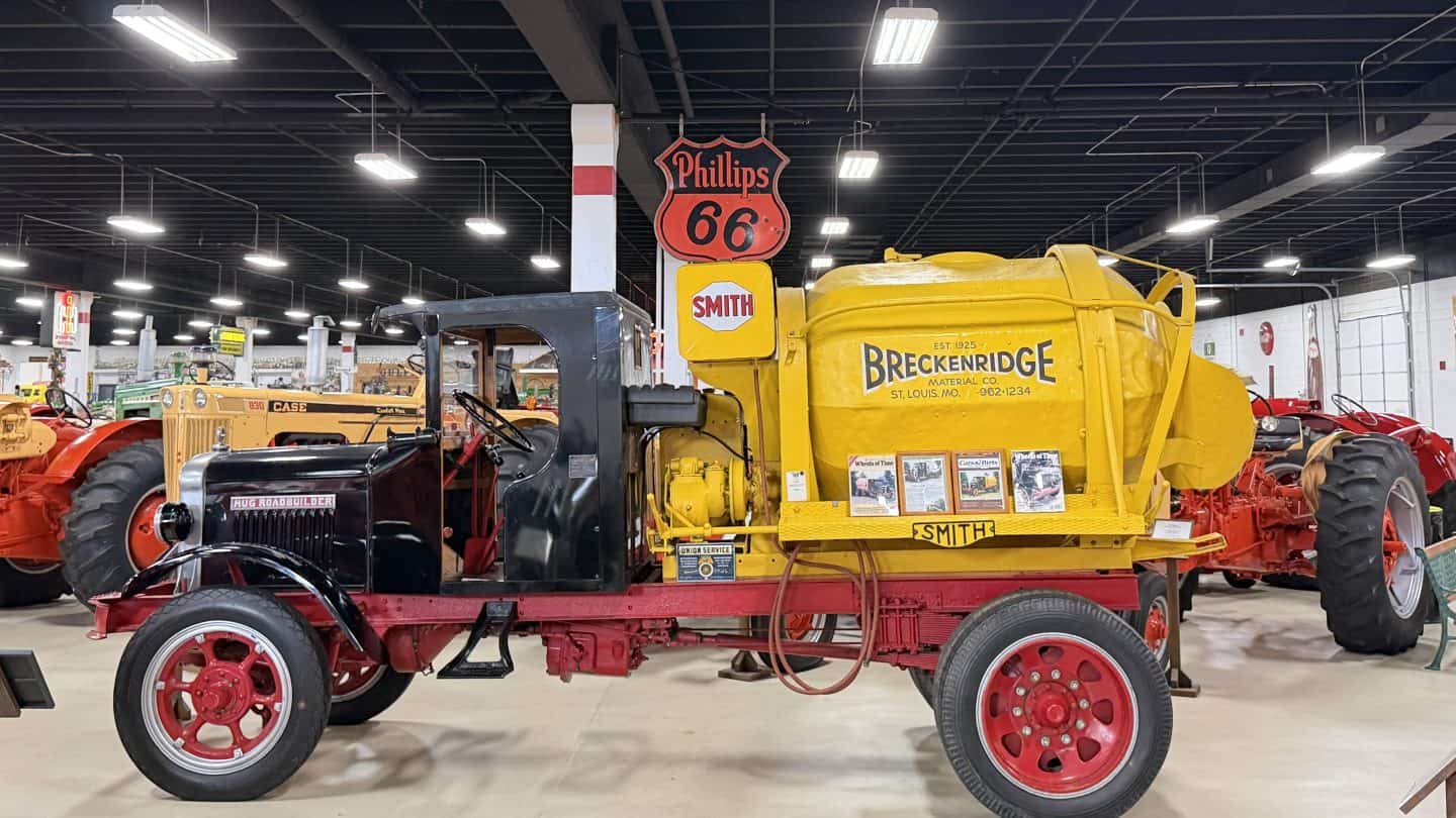keystone_truck_museum_breckenridge - Adventures with Carli Inside of Keystone Truck and Tractor Museum with vintage tractors; a large yellow Breckenridge tanker on a red trailer dominates the foreground, Phillips 66 sign overhead.