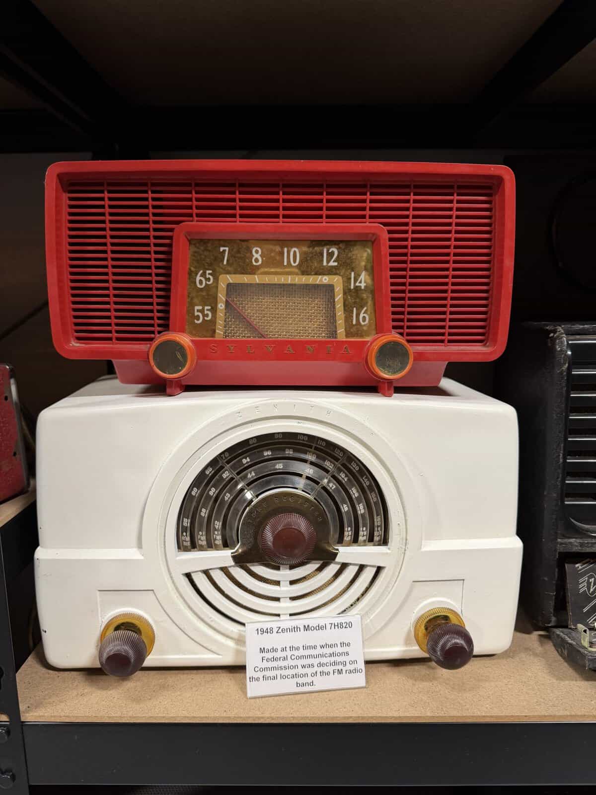 keystone_truck_museum_clock_radio - Adventures with Carli Red vintage Zenith radio with large front dial and two orange knobs atop a white appliance surface.