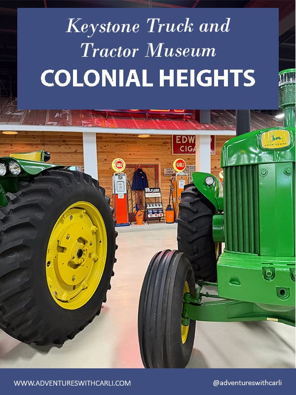 poster reading keystone truck & tracktor museum background image of two large john deere tractors with vintage gas station displaye set up in back